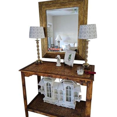 Rattan and gold framed mirror