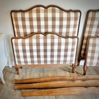 First of two antique twin beds, recently reupholstered in brown gingham on headboard and footboard