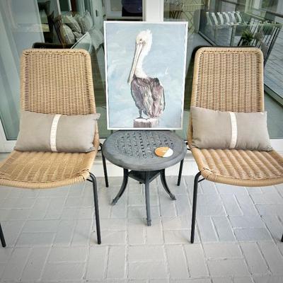Two woven chairs and two metal patio tables