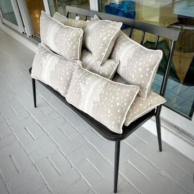 One of two metal outdoor benches