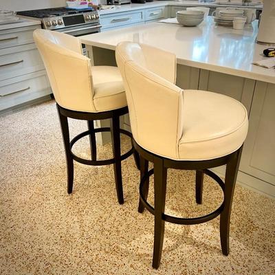 One of two Pier 1 swivel bar stools