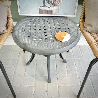 Two woven chairs and two metal patio tables