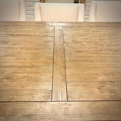 Wood trestle dining table and 8 ivory armchairs