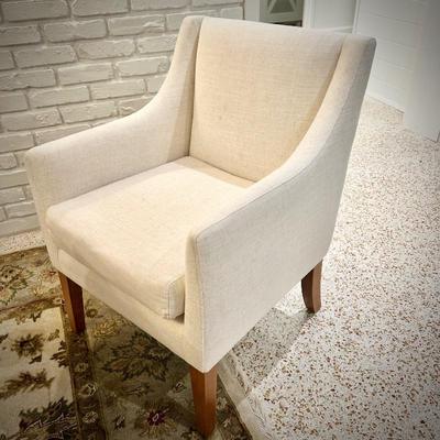 Wood trestle dining table and 8 ivory armchairs