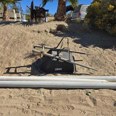 #2608 • Wheelbarrow and 3 Pieces of 4in PVC Pipe
