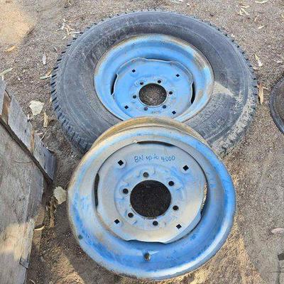 #2718 • (2) Ford Tractor Front Wheels with (1) Tire
