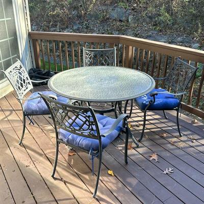 (5pc) OUTDOOR PATIO SET | Including: 4 cast aluminum with grated back and scroll curved arms, round glass top table with curved legs and...