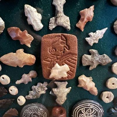 Collection of Native American arrowheads and beads 