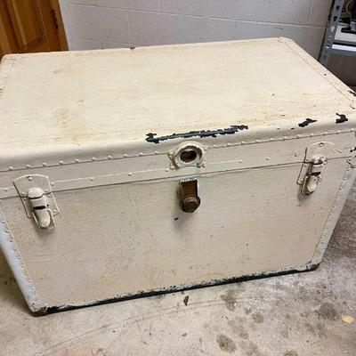 Lot 014-GAR: Vintage Travel Trunk

Features: 
•	Painted white metal exterior
•	Removable two-compartment top section
•	Spacious and...