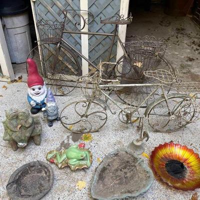 Lot 095-GAR: Bikes & Gnomes

Features: 
•	2 metal yard bike plant holders
•	2 yard gnomes
•	1 dinner bell
•	1 frog statue
•	A variety...