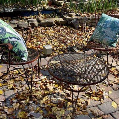 Lot 086-PAT: Wrought-Iron Bistro Set

Features: 
•	Reddish-Brown wrought-iron Bistro table and 2 matching chairs
•	Pillows included...