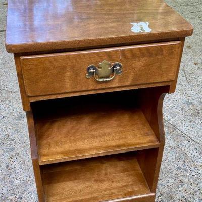 Lot 031-GAR: Ethan Allen Nightstand

Features: 
•	Made in 1982
•	Has a glossy finished top.
•	Hardwood construction; backing is pressed...