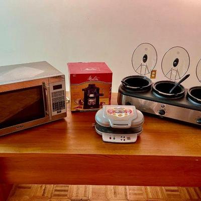 Lot 047-GAR: Kitchen Appliances

Features: 
•	Melitta Café MEX1B 4-cup Cappuccino maker. Still in its original box and appears...