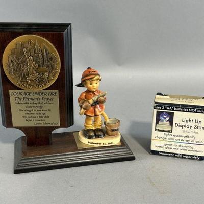 Lot 287 | Commutative Firefighter Plaque & Signed Goebel
