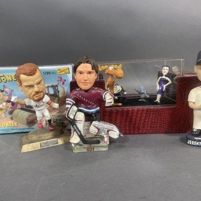 Lot 206 | Flintstone Flintmobile, Bobble Heads, and More
