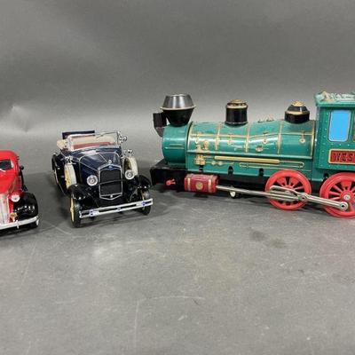 Lot 427 | Die Cast Cars and Plastic Train
