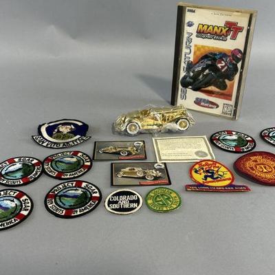 Lot 187 | Vtg Collectable Car, Patches, & Manx TT Video Game
