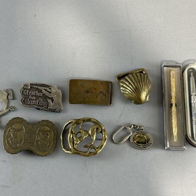 Lot 131 | Vintage Belt Buckles, Pens, Keychain, & More

