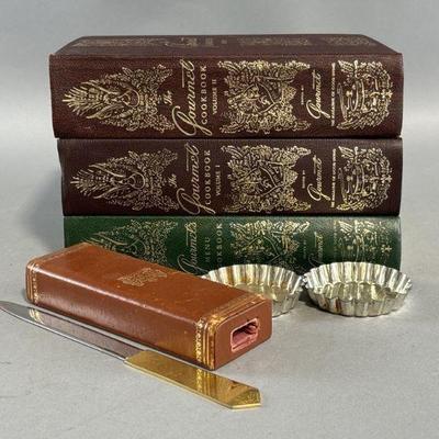 Lot 409 | Vtg Gourmet Cookbooks, Cordon Bleu Tins, & More
