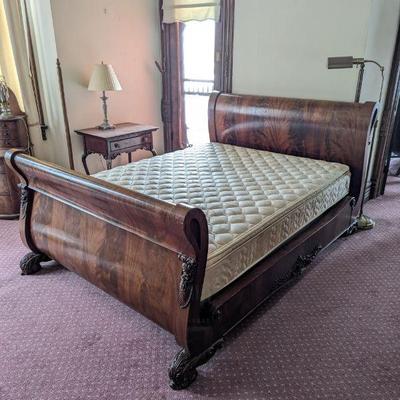 Lot #93 -  Antique Mahogany Sleigh Bed with Intricate Carvings and Queen Mattress