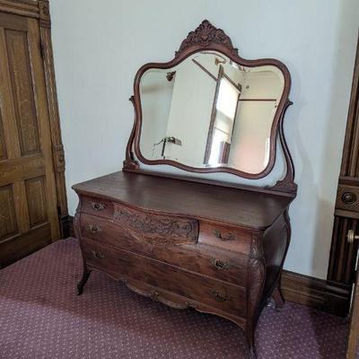 Lot #85 - Antique RJ Horner Company? Ornate Serpentine Dresser With Mirror