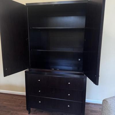 Barbara Barry for Baker Furniture Reed Armoire. Optimized for a television in the cabinet. Comes with two adjustable shelves and...