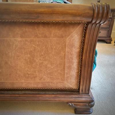 Queen bed with wood and leather headboard and footboard