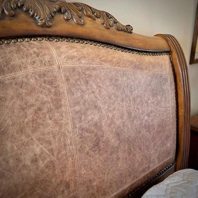 Queen bed with wood and leather headboard and footboard