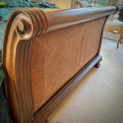 Queen bed with wood and leather headboard and footboard