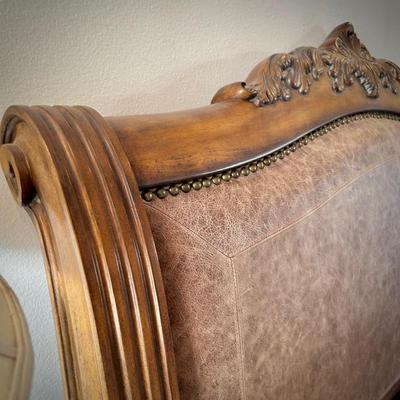 Queen bed with wood and leather headboard and footboard