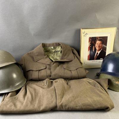 Lot 297 | Original WWII Uniform & Type M1 Combat Helmets
