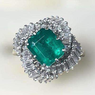 A 14k White Gold Diamond and Emerald Ring