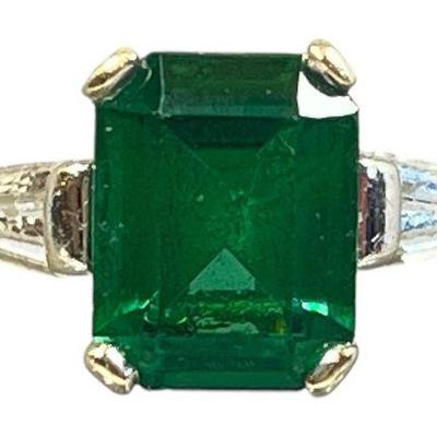 A 14k Gold Emerald and Diamond Ring