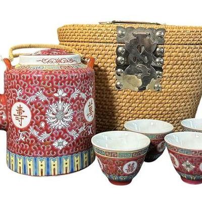 A Chinese Porcelain Tea Set with Traveling Wicker Basket
