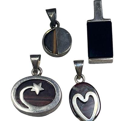 Four Danish Sterling Silver, Onyx, Tiger's Eye, and Jasper Pendants