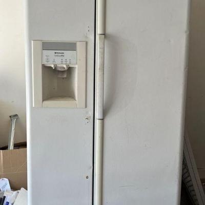 Frigidaire side-by-side refrigerator with water and ice dispenser