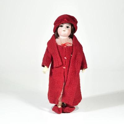Antique German Porcelain Head Doll | Porcelain head, natural hair, in red wool clothing; accompanied by a display case. - h. 14 in

