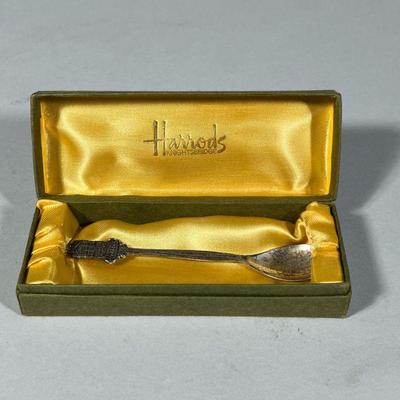 HARRODS STERLING SPOON | Sterling souvenir demitasse spoon in a conforming silk-lined box, the handle showing the Harrods Knightsbridge...