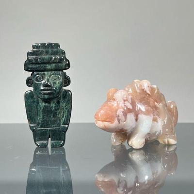 (2pc) CARVED STONE FIGURES | Including a Mayan style figure or belt hook carved in a dark green stone, and a carved chameleon in a...