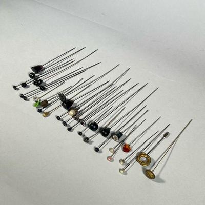 HAT PIN COLLECTION | Vintage hat pins, including an art nouveau-style flower pin, a brass eagle and shield, an engraved metal knot,...