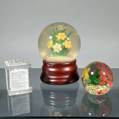 (3pc) PAPERWEIGHTS & SNOWGLOBE | Including a colorful art glass paperweight (apparently unsigned), a miniature printing of...