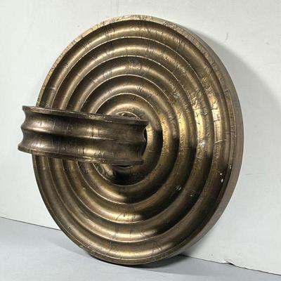 CONTEMPORARY FORMED METAL WALL SCONCE | Gold toned foil over carved composition layers, having concentric rings with a black velvet-lined...