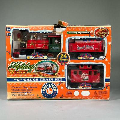 LIONEL HOLIDAY TRAIN SET | Vintage Lionel G Gauge train set, no. 62060, battery operated with locomotive, gift car, and caboose.

