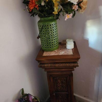 Wooden pedestal and floral arrangement