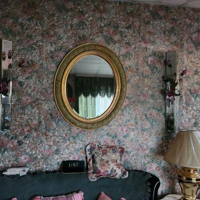 Gold rimmed wall mirror