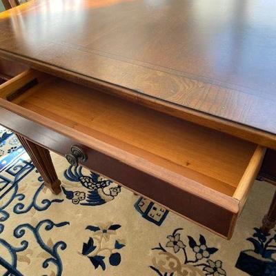 SHOWING DRAWER IN TABLE AND THE TABLE HAS TWO LEAVES