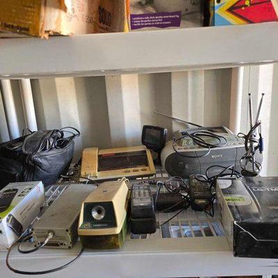 #3376 • Magellan GPS, Emerson Slimline Telephone, LG-TM510 Cell Phone, JC Penny Telephone Clock Radio
