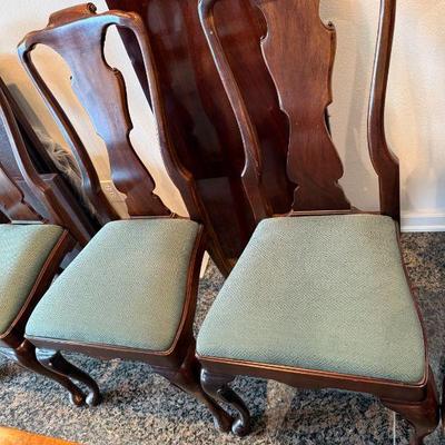 Henredon chairs with green upholstered seats.