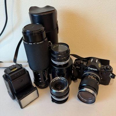 Cannon  (A-1 SLR  35mm film camera, Wide Angle 28mm Lens, 50mm Lens, 100-300mm Zoom Lens, Speedlite Flash)