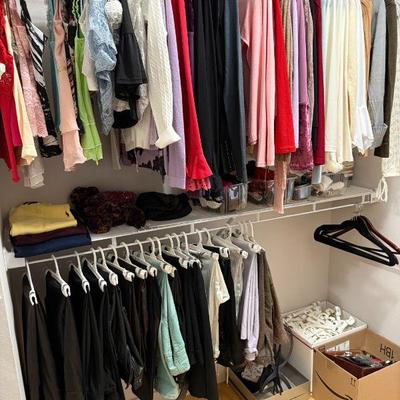 Sale Photo Thumbnail #59: Women's Clothing - Blouses, Sweaters, Slacks, Leather Pants. Also Men's Polo Sweaters folded on rack.